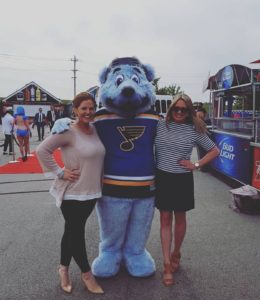 Strategic Business Delevoplement Manager, Keelyn Schwegel (left) with St. Louis Bluess mascot, Louie, and business partner and friend, Amanda Schubring.